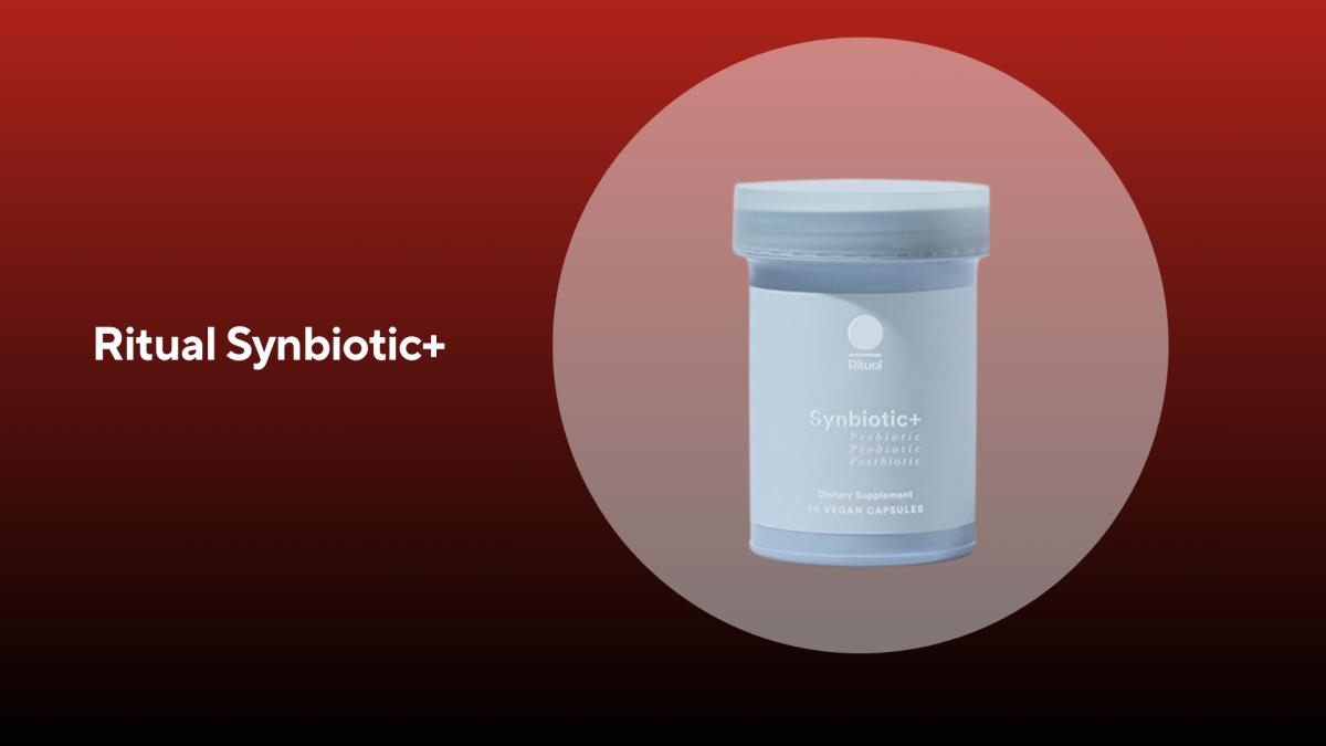 A light blue bottle of ritual synbiotic+ probiotics against a red background